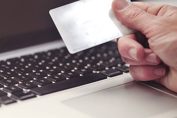 istock Online shopping using a credit card to complete an e-commerce 544734434