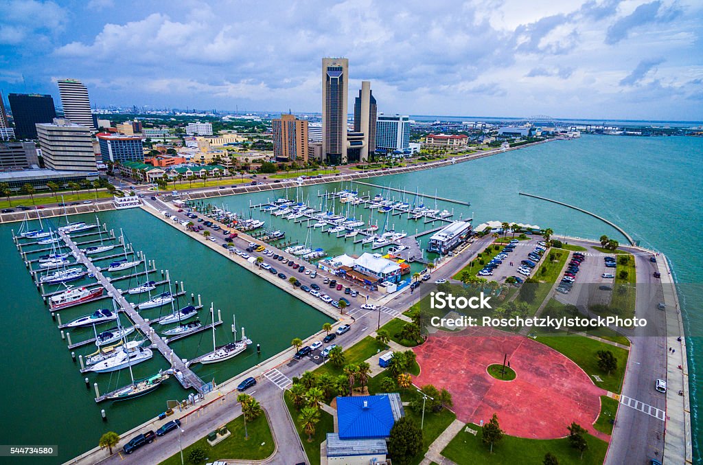 Corpus Christi Texas Aerial Over Marina Corpus Christi Texas Aerial Over Marina With a Circle pattern on the T-head and Sailboats and Yatch's on the marina on an amazing day with the CCTX skyline cityscape background and the Harbor Bridge in the distance. Coastal Small Town Paradise vibe.  Corpus Christi - Texas Stock Photo
