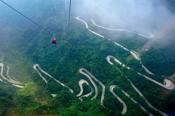 istock Passenger ropeway and winding mountain roads 01 544736348