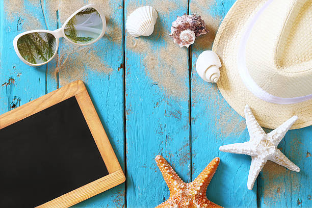 istock Top view of blank blackboard and beach accessories 544739794