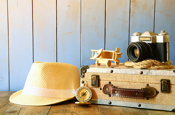 istock Compass, rope, old camera and toy plane. explorer concept 544739898