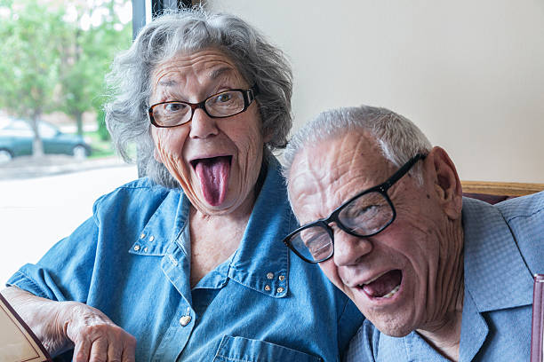 abuelo galería de bombardeos grandma la cara jocosa lengua simétrica - senior women cheerful overweight smiling fotografías e imágenes de stock