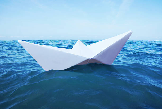 istock Toy paper ship on the sea 544743720
