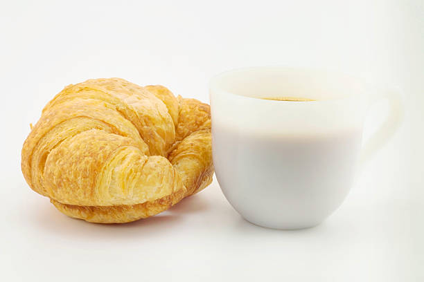 istock Croissant and coffee on  white background 544743928