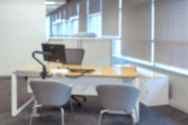 istock abstract business office desk with computer blur background 544745818