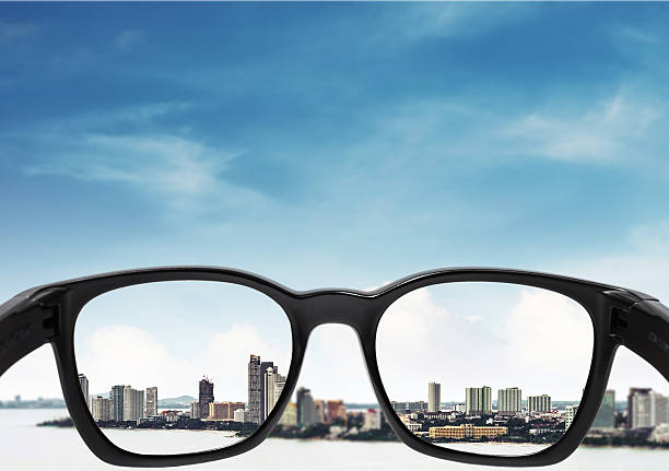 istock Glasses with city and sky background 544748282