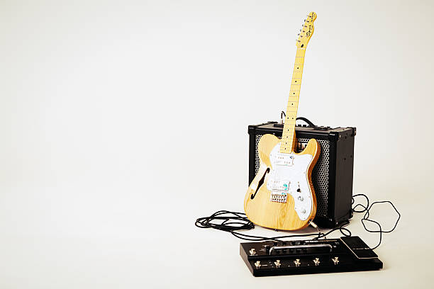 electric bass guitar, on a table, band concept, music, concerts, matte color photography