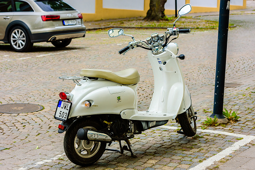 Motala, Sweden - June 21, 2016: Baotian retro 2013 moped parked in the street..