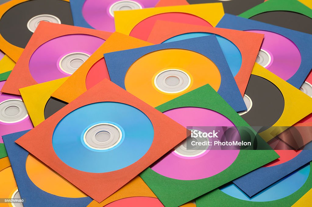 Large CD Pile Many Discs in Cases in a large Messy Pile. Compact Disc Stock Photo