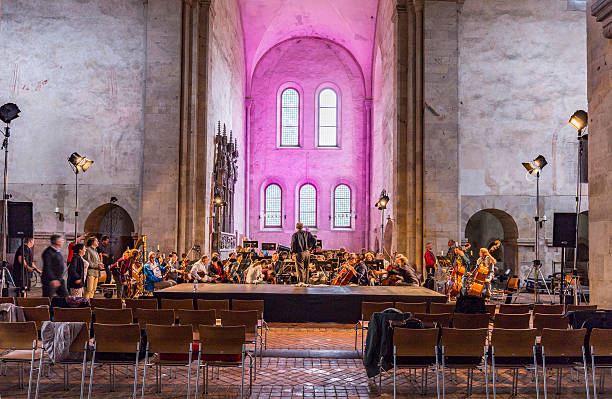 Eberbach, Germany - June 12, 2016: singer John Osborne and Lynette Tapia examin with the orchestra for tonights performance of famous arias of classical composer in the Basilika of cloister Eberbach.