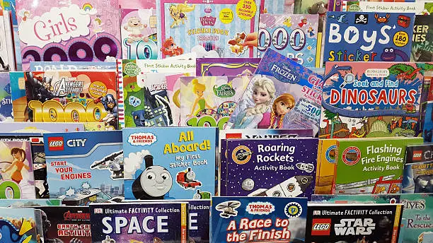 A rack of children's books covering a variety of subjects and interests.
