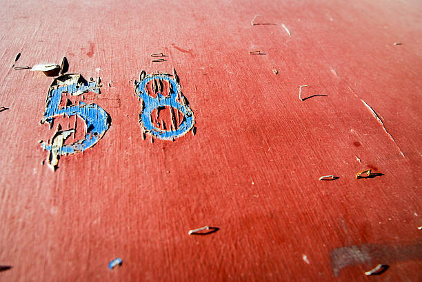 Number 58 on red wood wall Number 58 on red wood wall number 58 stock pictures, royalty-free photos & images
