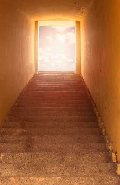 istock Heaven's gate. Staircase leading to open door and sky. 544790820