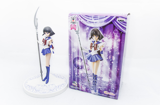 Milan, Italy - June 14, 2016: Closeup on a Sailor Saturn Action Figure with its box isolated on white.