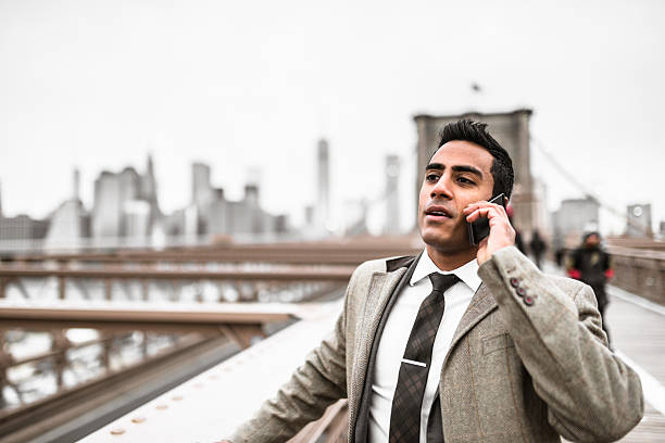 istock Businessman on the phone in brooklyn bridge 544791916