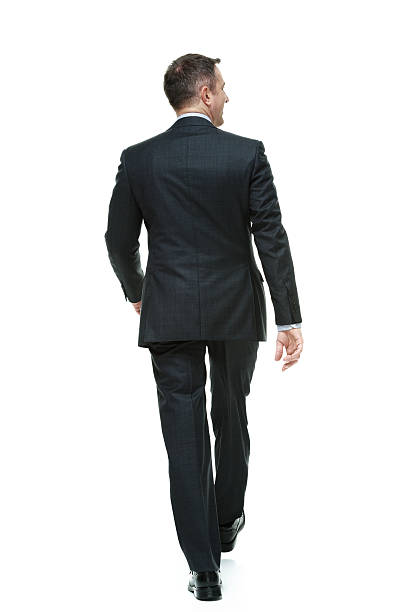 Rear view of businessman walking