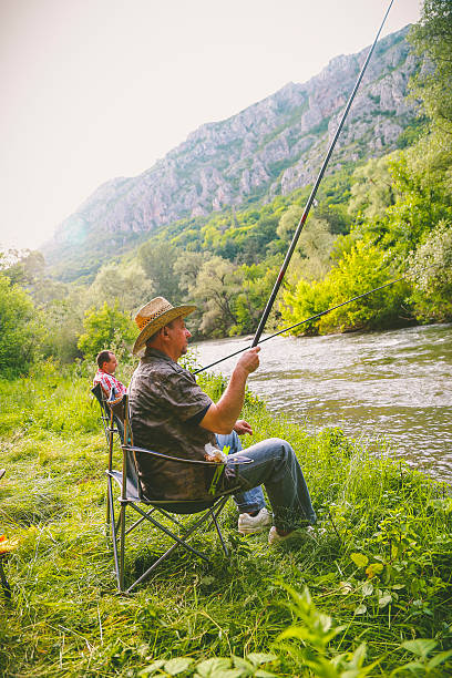 istock people fishing on the river 544793946