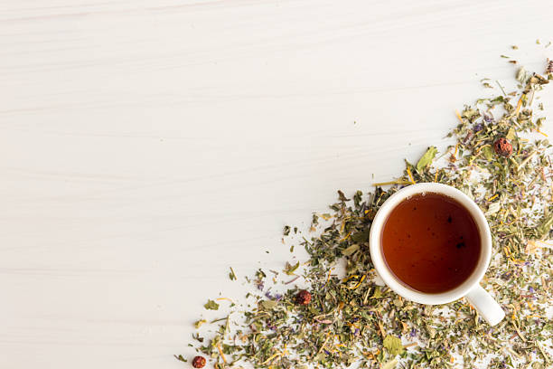 istock Cup of tea on table with herbs 544794018