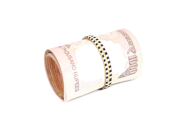 istock Roll of Indian rupees isolated on white 544794074