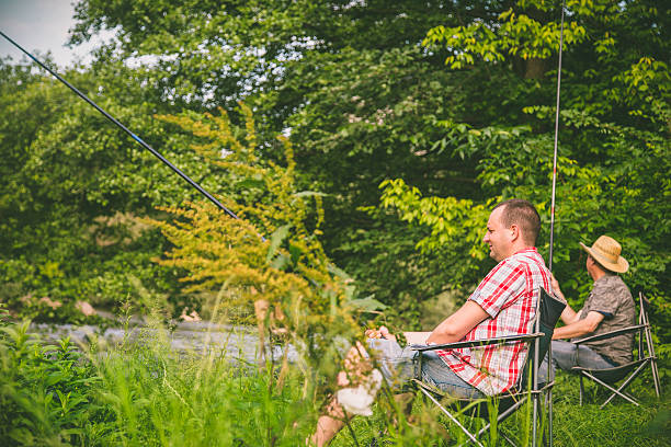 istock people fishing on the river 544794162