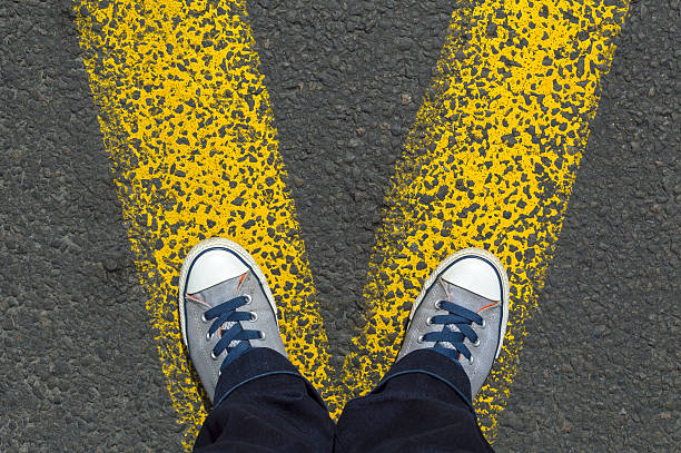 istock Sneakers standing on the yellow line 544794258