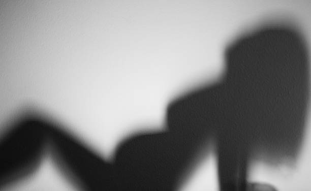 istock Naked pregnant woman shadow 544794574