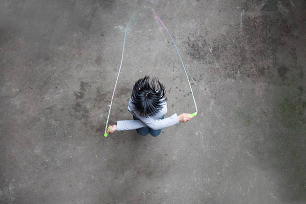 asian girl playing rope skipping