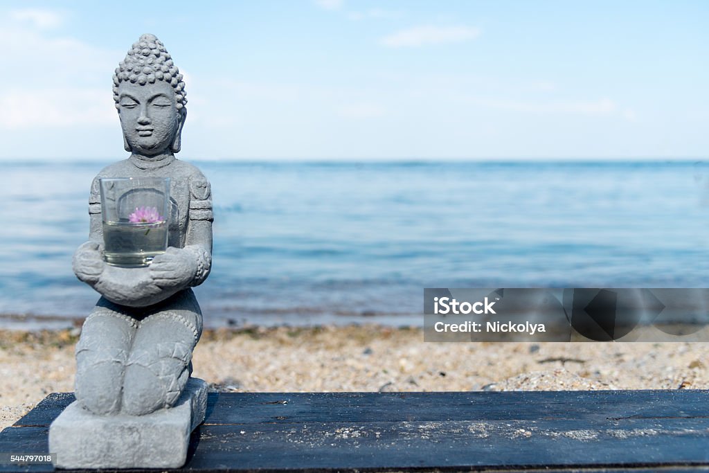 Buddha Statue Near The sea Buddha Statue Near The sea. Spa. Zen Beach Stock Photo