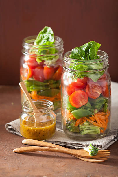 istock healthy vegetable salad in mason jar. tomato, broccoli, carrot, 544797026