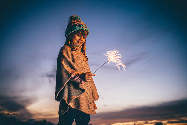 istock Little Girl Playing With a Sparkler 544797270