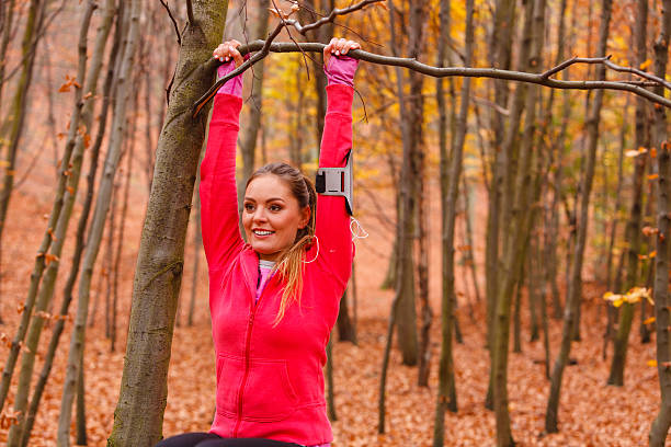 istock Young sporty girl doing exercises in forest. 544797278