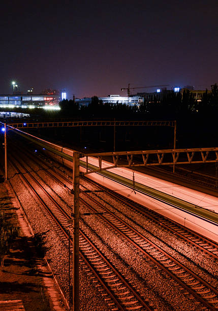 istock Railway station with motion train at night 544799804