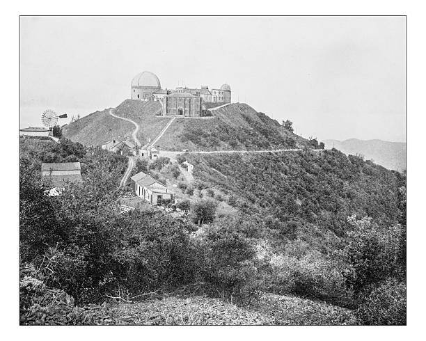 Antique photograph of the astronomical observatory called Lick Observatory on the summit of Mount Hamilton (Diablo Range , San Jose, California, USA) in a picture taken during the 19th century, depicting the complex of Classical Revival style buildings and domes of the observatory.