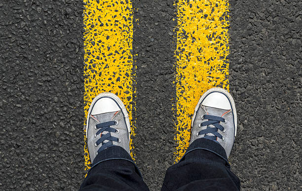 istock Standing on yellow street lines. 544801428