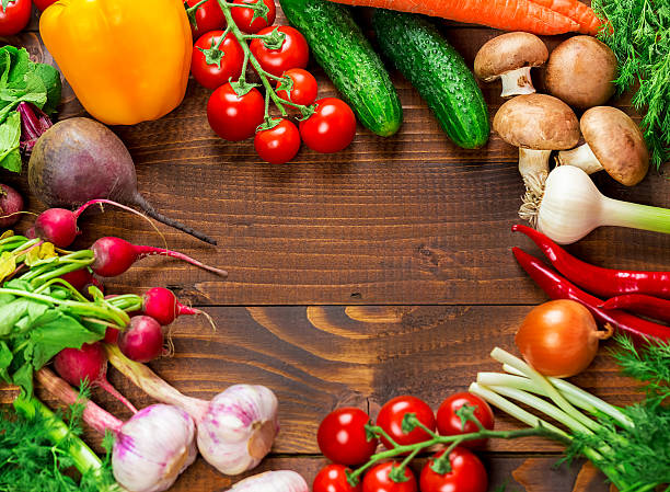 istock Studio photography the frame of different vegetables on boards 544801568