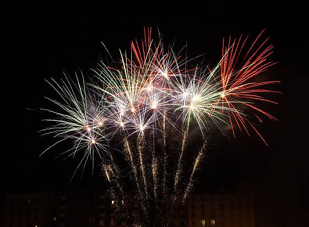 Green, white and red fireworks Benevento, Campania, Italy - July 4, 2016: the traditional fireworks that close the feast of Our Lady of Grace, the patron saint of Benevento and Queen of Sannio, which takes place every year from 1 to 3 July firework explosive material photos stock pictures, royalty-free photos & images