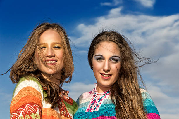 istock Two beautiful teens enjoy outdoor 544806440
