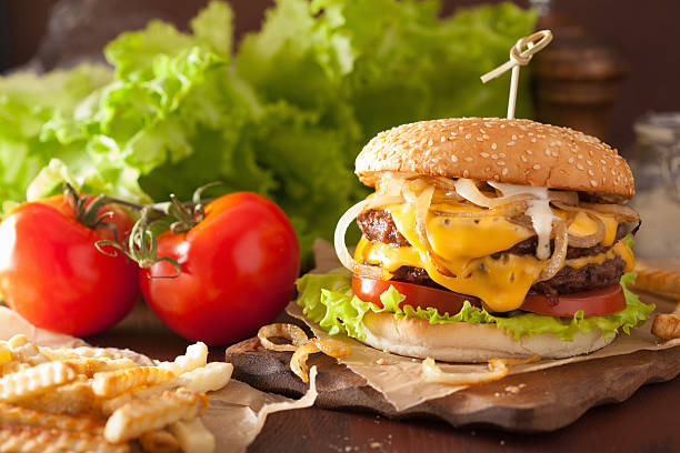 double cheeseburger with tomato and onion double cheeseburger with tomato and onion mcdouble stock pictures, royalty-free photos & images
