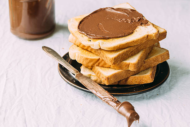 istock Slices of bread with chocolate cream. Close up. 544807794