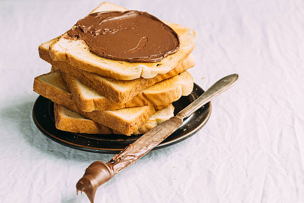 istock Slices of bread with chocolate cream. Close up. 544807820