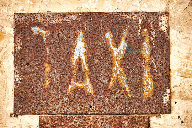 istock Caption taxi on a rusty metal plate 544809040