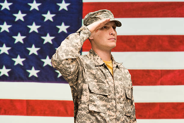 istock Soldier saluting and looking away 544809384
