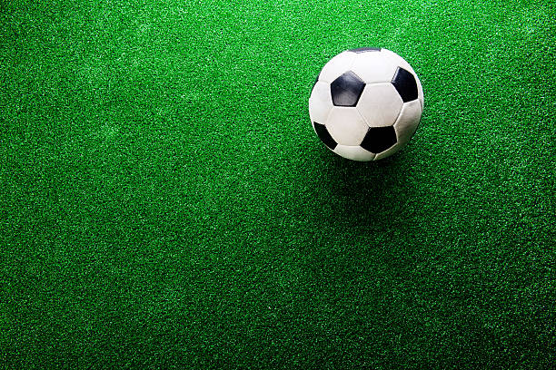 istock Soccer ball against artificial turf. Studio shot. Copy space. 544809886