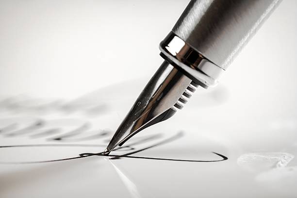 Fountain Pen Signing a signature with a fountain pen fountain pen photos stock pictures, royalty-free photos & images