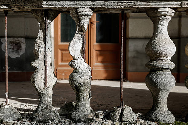 Old stone destroyed the railing on the background of the