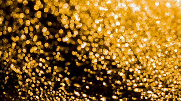 istock Gold Bokeh on black backgruond 544811478