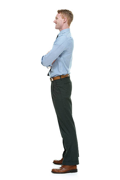 istock Smiling businessman standing with arms crossed 544811704