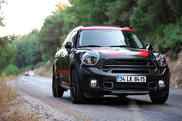 Mini Cooper Countryman Izmir, Turkey - June 24, 2016: Front view of Mini Cooper Countryman on the asphalt cooper countryman stock pictures, royalty-free photos & images