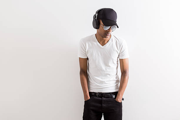 istock Black boy listening to music 544812566