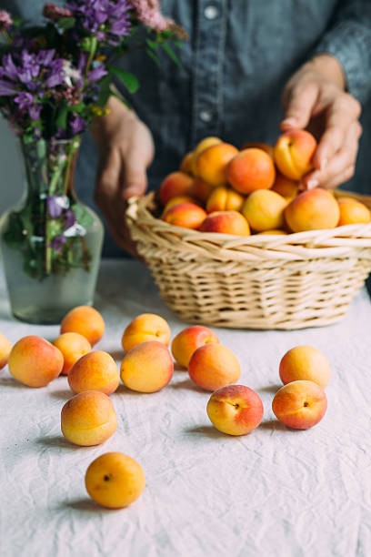 istock Fresh apricots in the basket on a table 544815996